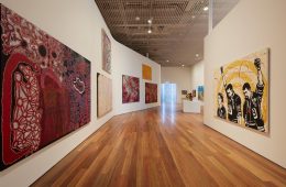 Installation view of the Yiribana Gallery featuring (left) Ned Grant, Fred Grant, Patju Presley, Lawrence Pennington and Simon Hogan 'Wati Kutjara' 2019 and (right) Richard Bell, Emory Douglas 'We can be heroes' 2014, photo © Art Gallery of New South Wales, Jenni Carter

***These images may only be used in conjunction with editorial coverage of the exhibitions presented at the Art Gallery of New South Wales, and strictly in accordance with the Terms of access to these images  see https://www.artgallery.nsw.gov.au/info/access-to-agnsw-media-room-tcs/. Without limiting those Terms, images must not be cropped or overwritten; prior written approval in writing is required for use as a cover; caption details must accompany reproductions of the images; and archiving is not permitted.***
Media contact: sophie.tedmanson@ag.nsw.gov.au